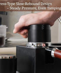 Pro Stainless Steel 58mm Coffee Distributor And Tamper With Slow Rebound Spring in use, applying steady pressure for even tamping.