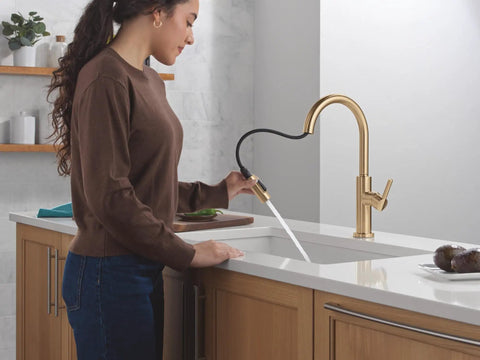 Modern Brushed Gold Kitchen Faucet With Pull Down Sprayer And Single Handle Slick Champagne Bronze Finish Smooth Glide Cartridge No Fuss Single Hole Setup in use.