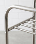 Close-up of stainless steel frame of Floor Standing Metal Storage Rack For Laundry And Home Organization Movable And Rust Resistant