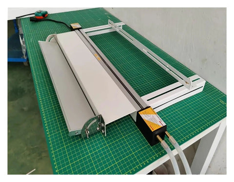 125Cm Acrylic Bender Heater Nailing Precise Temperature Control With Smart Water Cooling For Zero Hassle Plastic Sheet Bending on a green cutting mat.