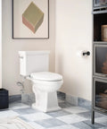 Bathroom with white elongated toilet featuring Standard Non Electronic Bidet Seat For Elongated Toilets With Dual Front And Rear Nozzles Water Pressure Control Soft Close Lid Self Cleaning Replaceable Nozzles Easy Operation EB500E on patterned floor.