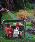 Heavy Duty Workhorse 7.5HP 212CC Gas Water Pump 2 Inch Twin Impeller High Pressure Transfer Machine 328 Ft Lift displayed outdoors.