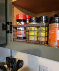 Farmhouse Small Metal Wire Storage Basket With Wooden Bottom Black Rustic Organizer in kitchen cabinet with spice jars