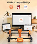 ACMER laser engraver machine on desk; orange-black frame with 300x300mm engraving area and 7000mW laser