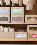4 Pcs Foldable Closet Storage Bins With Clear Window For Slick Organization And No Sweat Folding To Keep Your Wardrobe Tidy And Make Room Organization A Total Breeze. Fabric bins stacked with visible contents.