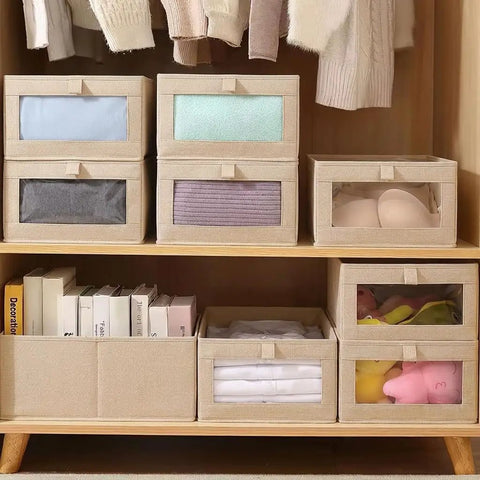 4 Pcs Foldable Closet Storage Bins With Clear Window For Slick Organization And No Sweat Folding To Keep Your Wardrobe Tidy And Make Room Organization A Total Breeze. Fabric bins stacked with visible contents.