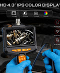 Gloved hands using Pro Borescope Camera With Light, 4.3 Inch HD Screen, 1080P Handheld Endoscope in automotive inspection.