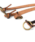Close-up of leather game carrier strap with 12 drop slip rings for dove, duck, quail, pheasant, and small game bird tote hanger.