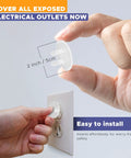 Close-up of hand inserting Baby Proof Outlet Covers 36 Pack White No Sweat Easy Press In Fit into an electrical outlet.