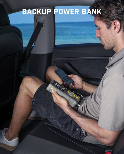 Man using Fast Inflate Portable Tire Inflator With 150 PSI Cordless Power And LED Dual Screen as backup power bank in car
