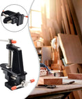 Handy Space Saving Mini Bench Vise with cast aluminum body and steel screw and handle in a woodworking shop setting