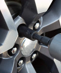1/2 Inch Drive Deep Impact Lug Nut Socket Set With Case Beefy Nine Piece Inch And Metric Deep Sockets 3/4 To 15/16 In And 17 To 22 mm Includes 3 Inch Extension Heavy Duty Automotive Tool Kit being used on a car wheel lug nut