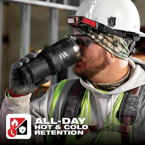 Construction worker drinking from Packout Insulated Tumbler 890 Ml Black With Two Wall Vacuum Insulation That Keeps Beverages Hot Or Cold All Day