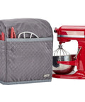 Quilted Dust Cover With Pockets For KitchenAid Stand Mixer 6 7 8 Quart Bowl Lift Grey Patent Design Protects Against Dust And Scratches Keeps Your Mixer Ready To Roll shown beside red mixer