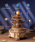3D Wooden Orrery Solar System Puzzle Kit for Adults, Huge Planet Model With 8 Orbiting Planets, Mechanical Gear Building Toy, Easy Assembly, Epic Gift for Science Lovers and STEM Fans. Wooden orrery with handcrank and orbiting planets on desk