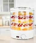 Heavy Duty Electric Food Dehydrator With Five Clear Trays And Adjustable Heat Zones For Zero Fuss Drying Of Fruit Meat Jerky And Custom Pet Treats Perfect For Family Dinners And Weekend Meal Prep with fruits on trays.