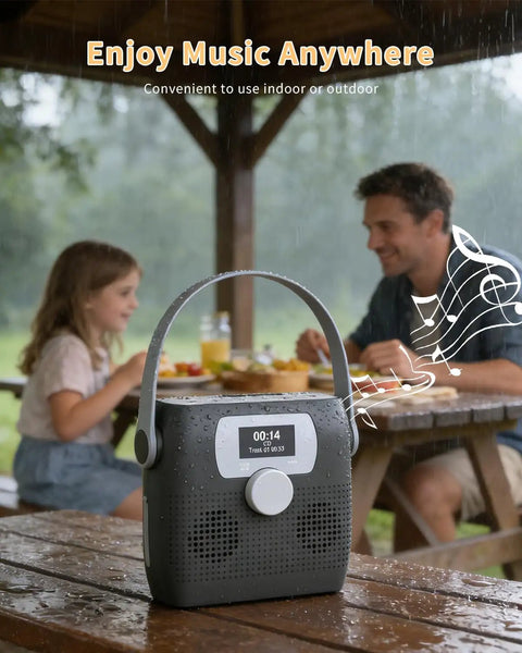 Portable CD Player With Bluetooth Boombox And Built In FM Radio For Camping And Travel Waterproof on picnic table in rain