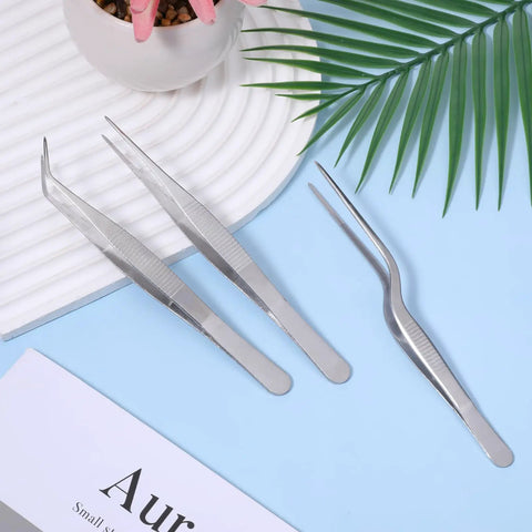 Pro Grade Garden Tweezers Set Of 3 Stainless Steel Plant Tweezers With Straight And Curved Tips, Dope Precision Bonsai Tools For Indoor Outdoor Gardening, Kitchen And More, 6.22In, 6.33In, 6.4In stainless steel tweezers set on blue surface