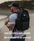 Man wearing Military Inspired Tactical Diaper Backpack For Dads With 24L Capacity Water Resistant 600D Polyester Includes Changing Mat Bottle And Gear Organizer Durable On The Go Dad Bag For Active Families outdoors