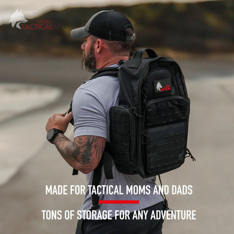 Man wearing Military Inspired Tactical Diaper Backpack For Dads With 24L Capacity Water Resistant 600D Polyester Includes Changing Mat Bottle And Gear Organizer Durable On The Go Dad Bag For Active Families outdoors