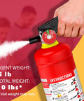 Close-up of ABC Dry Chemical Fire Extinguisher 5 Lb for Home Office and Car 2-A:10-B:C rated, quick release easy grip handle in use