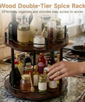 Two-Tier Wood Lazy Susan Organizer With 360 Turntable And Adjustable Upper Tray on kitchen countertop with spice jars