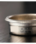 Dope Titanium Espresso Distributor And Ground Leveling Tool For Even Coffee Bed Prep In 58.5mm Portafilter Baskets close-up view.