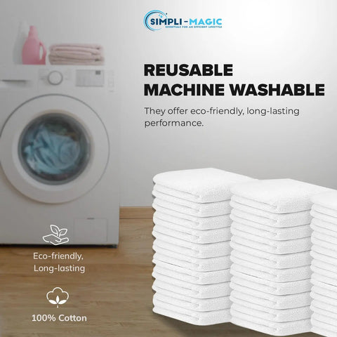 Stack of 60 white cotton terry towels 14x17 inches next to a washing machine for kitchen, bar, and restaurant cleaning use.