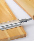 Easy Push to Open Cabinet Damper Buffer with Magnetic Catch in silver aluminum alloy on wooden surface