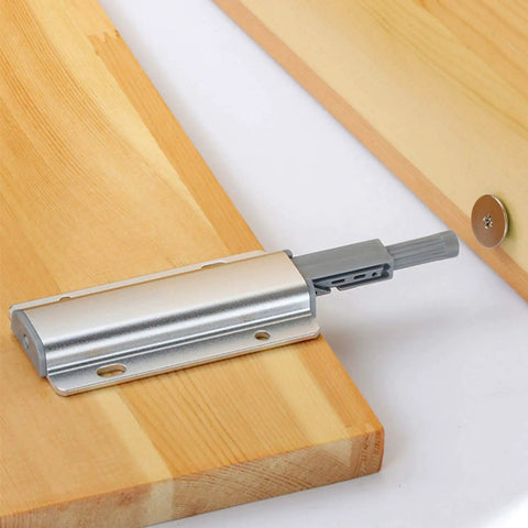Easy Push to Open Cabinet Damper Buffer with Magnetic Catch in silver aluminum alloy on wooden surface