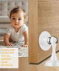 Heavy Duty Stainless Steel Door Stopper With Magnetic Catch, white, installed on wooden door, toddler in background