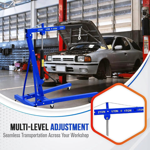 2 Ton Folding Engine Hoist With 4400 Lb Hydraulic Capacity, Heavy Duty Cherry Picker in workshop with car hood open.
