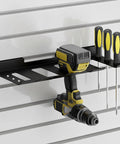 Slatwall Power Tool Organizer 1 Pack With Four Drill Holders Heavy Duty Cordless Tool Rack Mount installed on slatwall with tools