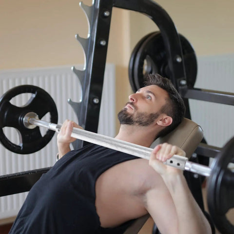 Man using the Beefed Up Dumbbell Connecting Bar For Weightlifting Equipment With Steel Tube Construction And Ultra Precise Threads, Anti Slip Connector Rod