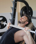 Man using a Steel Tube Dumbbell Connecting Rod For Strength Training And Home Gym Use Barbell Connector with weights