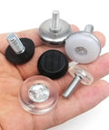 Hella Smooth Chair Leg Floor Savers 72 Piece Set Black And Clear Adjustable Glides displayed in a hand, showcasing different sizes and materials.