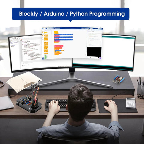 ACEBOTT 4-DOF ESP32 robotic arm kit on desk with computer screens displaying Blockly/Arduino programming