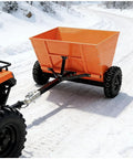 Beefy 71 Gallon Tow Behind Sand And Gravel Spreader For ATV And UTV on snowy road