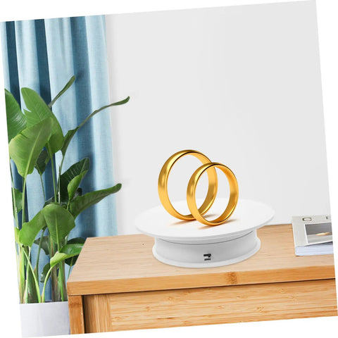 Autonomic Electric Rotating Display Stand For Jewelry Watches And Collectibles With Adjustable Speed, showcasing two gold rings on white turntable.