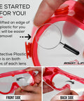 Badass Kids Safety Goggles With Ultra Clear Anti Fog Lenses And Impact Resistant Frame For Science Lab and Woodworking Crafts Comes In A Sweet 144 Bulk Case Pack, showcasing lens protective film removal.