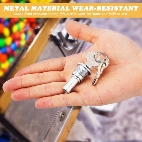 Thinking Process: metal lock and 2 keys for candy machine, silver flat key set in hand, about 1.57 x 0.86 x