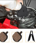 4 Pairs Mountain Metallic Disc Brake Pads For Bikes in resin type being installed on a bicycle for smooth stops and heat dissipation