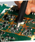 Using 7 Piece Soldering Repair Tool Kit With Desoldering Pump And Wick on a circuit board for maintenance