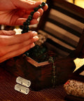 Hands holding beads over a jewelry box with Hidden Brass Barrel Hinges Set Eight Pack For Jewelry Boxes And Cabinets.