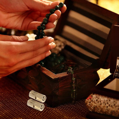 Hands holding beads near jewelry box with Concealed Brass Hidden Hinges Eight Pack For Jewelry Boxes And Cabinet Doors