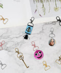 Top Shelf Swivel Clasp Clip Hooks 60 Pack For Keychain Making And Lanyards Featuring Badass D Ring Metal Hardware detail on marble background.