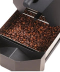 Electric Coffee Bean Roaster Equipped With Auto Roasting Curves And Compact Smoke Filter Commercial Grade setup with roasted coffee beans.
