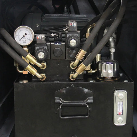 Hydraulic components of the Tough Three Roll Hydraulic Metal Bender featuring motors, gauges, and hoses for efficient metal bending.
