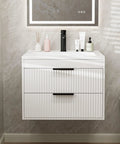 No Fuss 24 Inch Wall Mount Bathroom Vanity With Durable Resin Sink And Deep Twin Drawers, Smooth White MDF Floating Cabinet Featuring Matte Black Handles.
