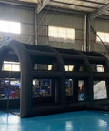 Black Inflatable Tennis Court Style Tent And Baseball Batting Cage With Blower Portable 19.68 Ft By 9.84 Ft in warehouse setting